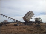 The truck empties the dirty peanuts into a hopper