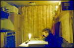 Doing homework in the caravan by candlelight